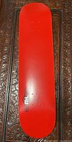 Red underside of skateboard deck