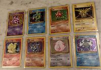 Eight sleeved Korean Pokémon cards arranged in two rows of four