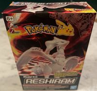 Front of sealed Reshiram model kit box showing Pokémon and Bandai logos