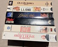 Stack of six VHS tapes showing front spines