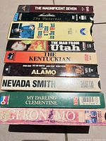 Stack of nine Western film VHS tapes showing all spine titles