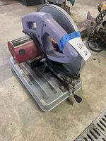 Overall view of Chicago Electric metal cut-off saw on base