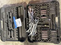 Open Craftsman case showing sockets, wrenches and empty slots