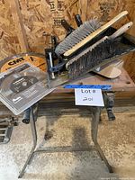 All items on saw stand including brushes and blades