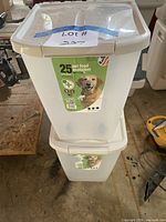Two stacked Van Ness 25-lb pet food containers showing size and lids