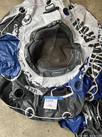 Deflated Intex River Run tube showing mesh seat, cup holders, grab rope