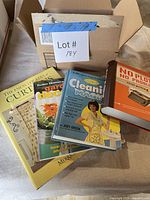 Four hardcover instructional books fanned on surface