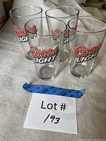 Four Coors Light pint glasses front view showing logos
