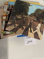 Stack of vinyl LPs, top record Abbey Road