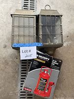 Overall lot showing two lantern fixtures and Husky jack box
