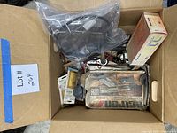 Top view of box showing multiple automotive tools and parts