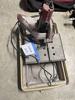 Full view of MK wet tile saw in water tray with cord