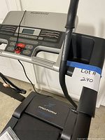 Side angle of console and frame with fold-up handle