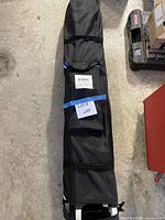 Full view of Quik Shade canopy in black carry bag