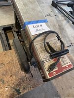 Overall view of radial arm saw with lot tag