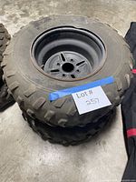 Stacked view of two Maxxis tires on steel wheels