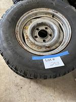 Full view of tire mounted on steel rim