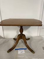 Full view of butler's table showing top, pedestal, and legs