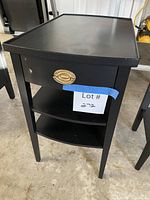 front view showing drawer and shelves