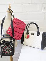 Three Betsey Johnson bags: white quilted tote, black telephone crossbody, red polka-dot pouch