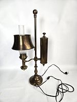 Full view of brass student lamp showing shade, column, base and electrical cord