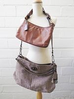 Both handbags displayed on mannequin