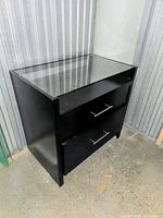 Full view of cabinet front and side showing glass top and drawers