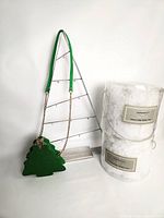 Full lot showing ornament tree, purse, two tubs of snow