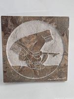 Front view showing full marble plaque and relief design