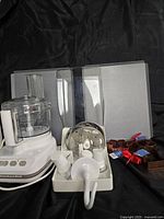 Full lot showing food processor, discs, dough hook, cookie cutters, cookie sheets
