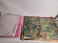 Stack of assorted print kraft paper sheets, sealed polka dot pack visible left, jungle animal print stack right