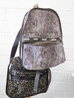 Backpack and shoulder bag hanging, full view