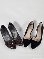 Both pairs of pumps side by side