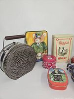 Front view showing Oreo, Harrods, M&M, Cream of Wheat and several smaller tins