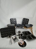 All bakeware pieces and utensils grouped