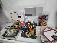 Lot overview with papers, tools, punches, scissors, storage tin