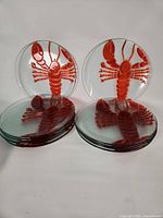 Stacked set of ten lobster plates showing quantities and overall appearance
