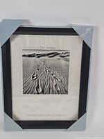 Full view of framed print with corner protectors