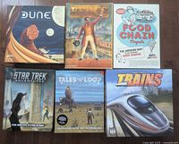Front view of six tabletop game boxes