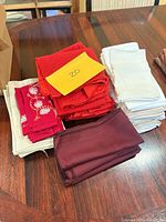 Stacks of assorted coloured napkins on wooden table