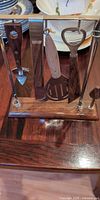 Overall view of bar tool set on stand showing all tools