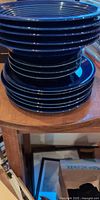 stack of cobalt blue ceramic dishes showing size variation