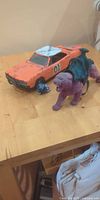 General Lee car, Panthor, blue Transformer figure on tabletop
