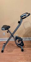 Side view of folding XTERRA exercise bike showing full frame and pedals