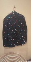Front view of Pac-Man patterned suit jacket on hanger