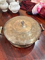 lidded metal serving dish, engraved floral design, handles