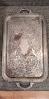 Top view of rectangular silver-plated tray showing overall design and wear