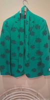 Front view of green shamrock jacket with matching tie