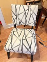 Front view of upholstered accent chair showing fabric pattern and overall form