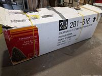 Cardboard box for 7.5 ft Kodiak Fir tree showing model and packaging condition